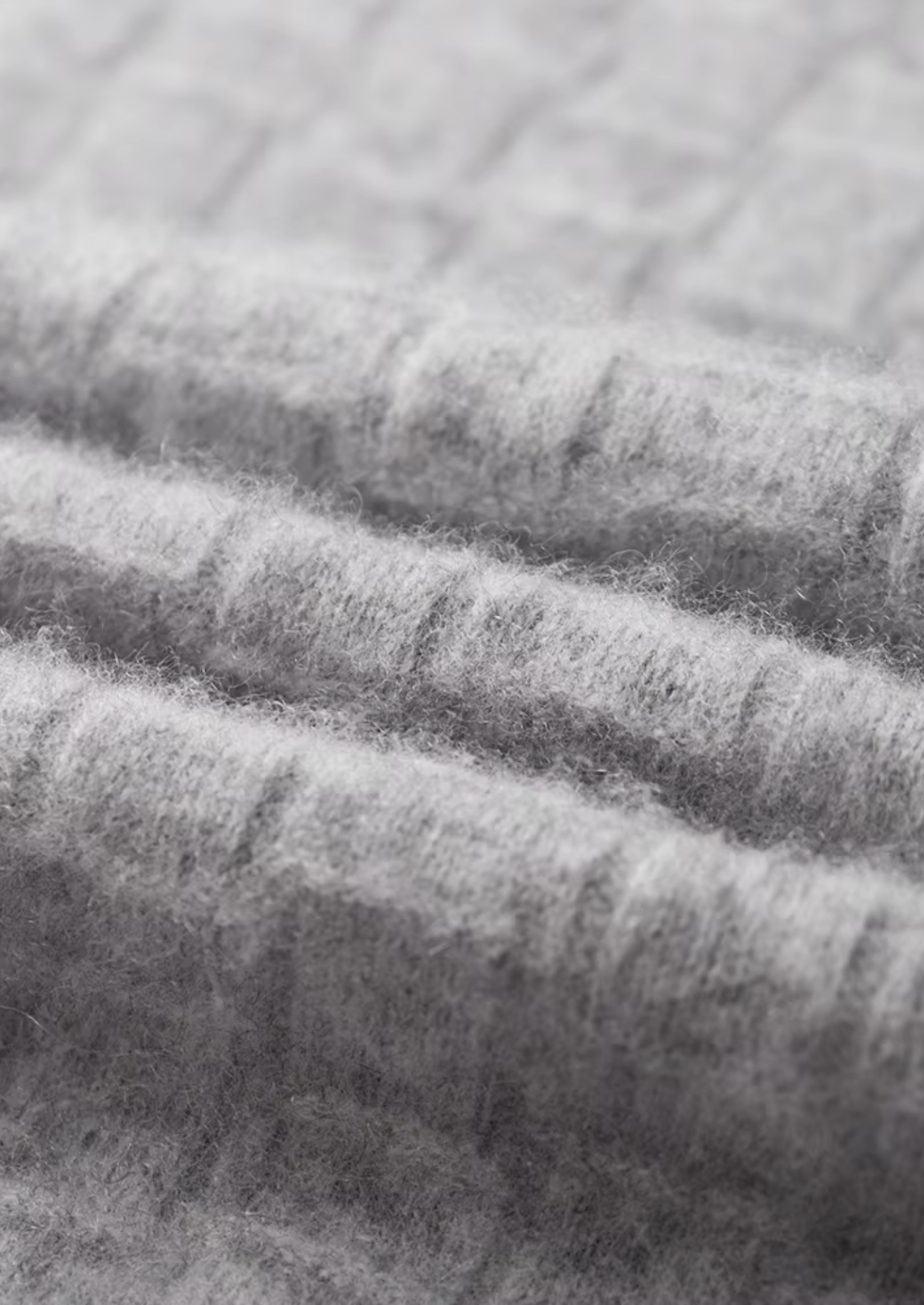 Col montant en laine mérinos extra-fine pure avec texture